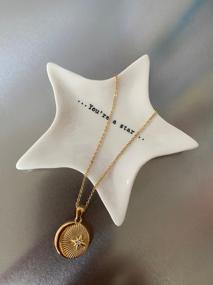 Detailed view of starburst pendant with sparkling zircon