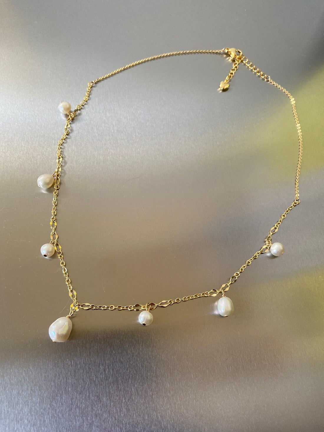 sculptural bars, dainty round bespoke links, perfectly round freshwater pearls